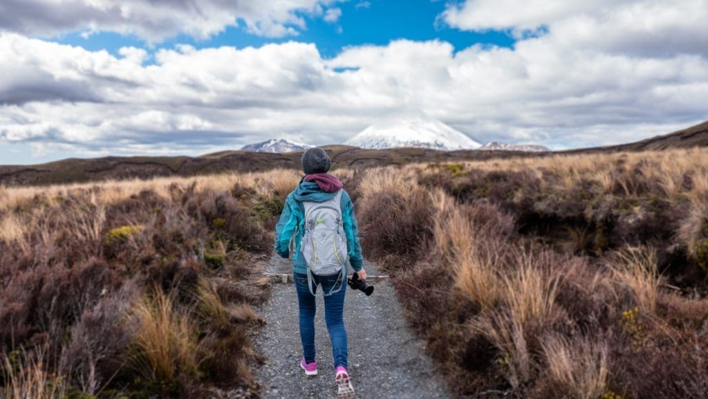 a woman hiking in New Zealand