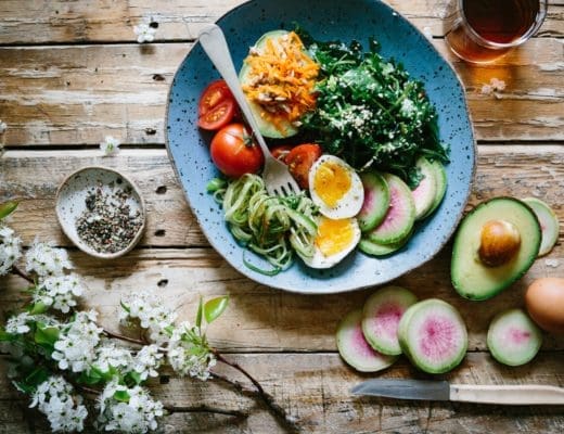 a bowl of colorful vegetables and eggs