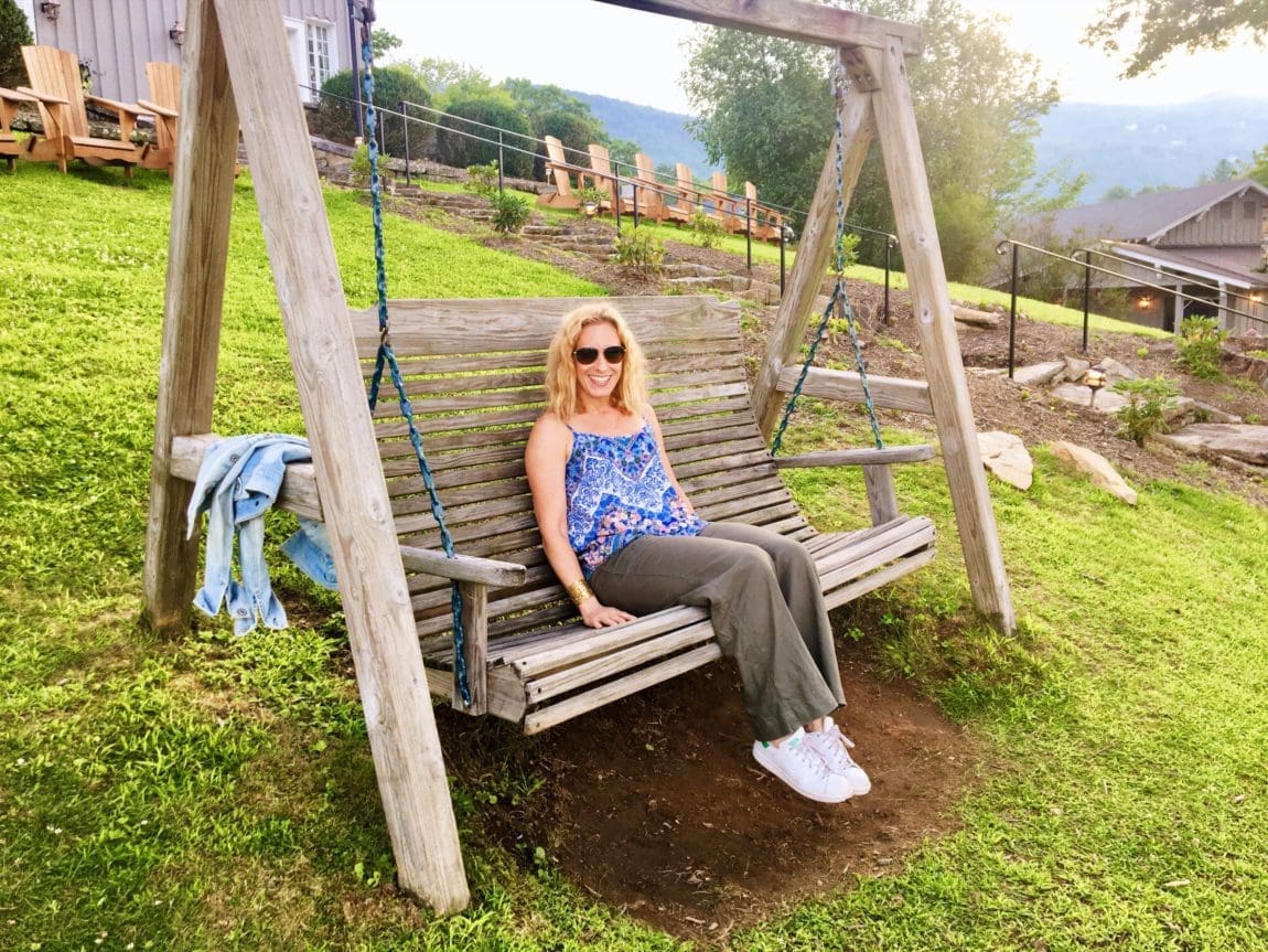 Merry lerner sitting on a wooden swing