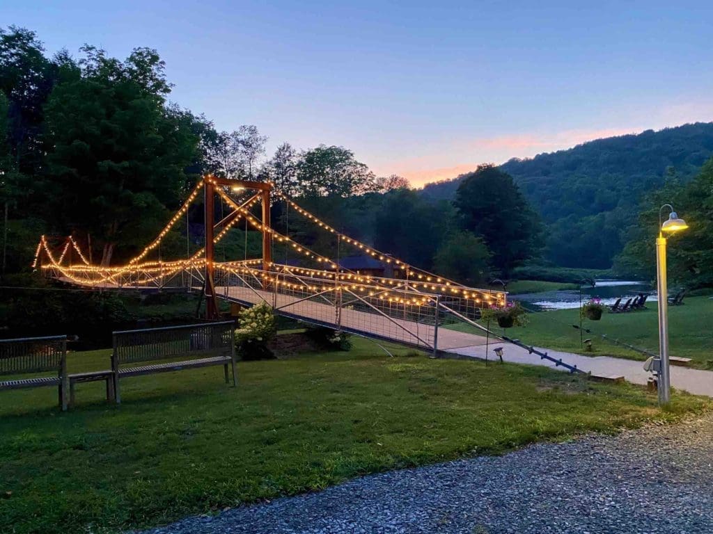 antrim-streamside-at-sunset-lit-up-bridge-over-creek-in-catskills