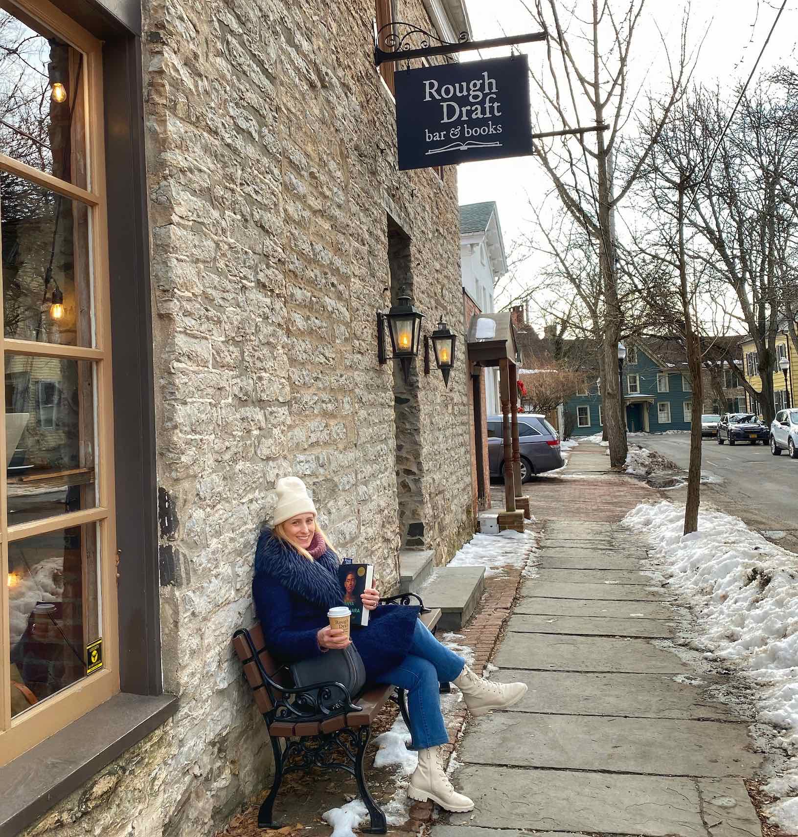 merry-sitting-outside-rough-draft-bar-and-books-uptown-kingston