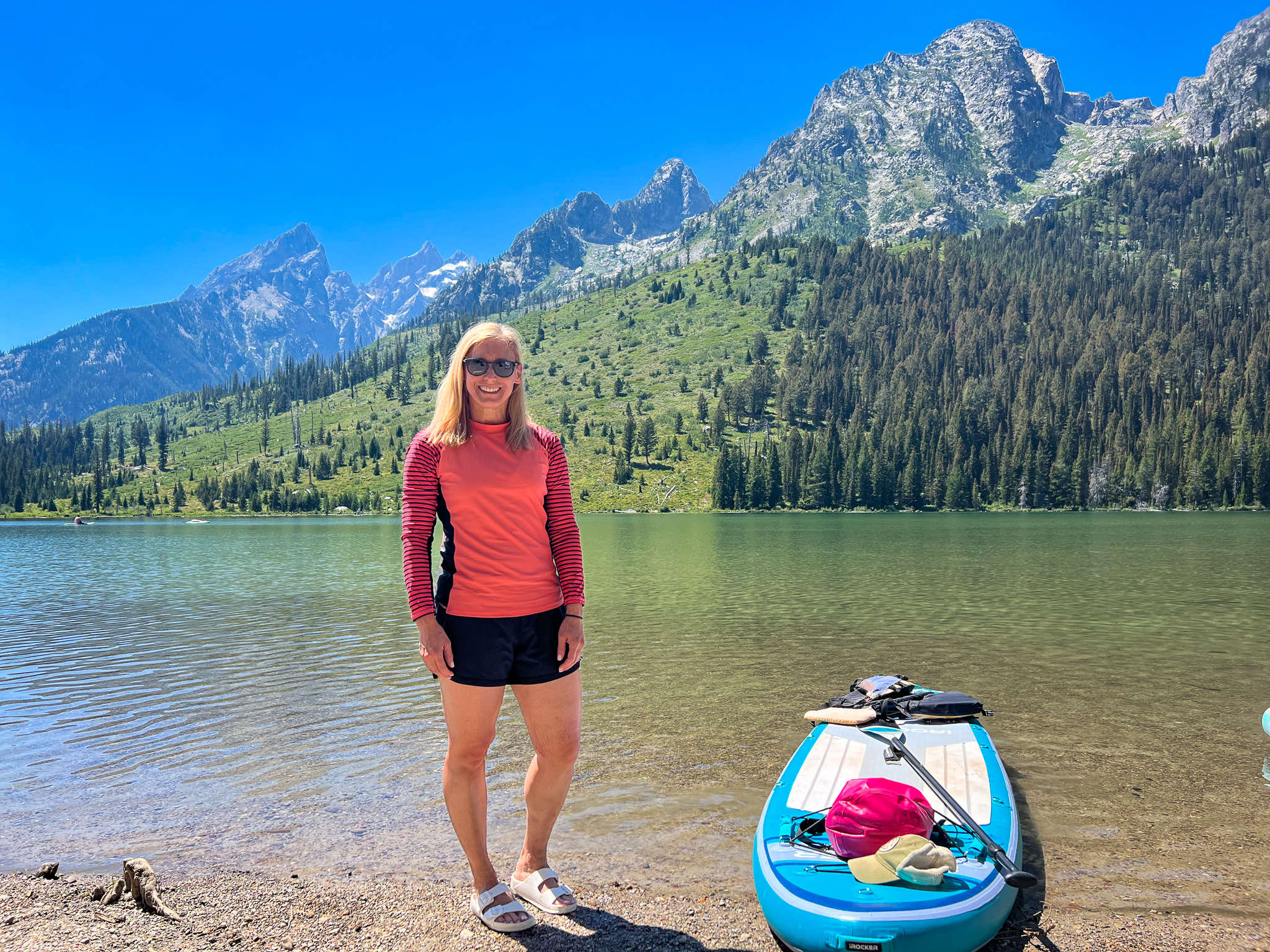 merry-paddle-boarding-string-lake-grand-tetons-national-park-wyoming